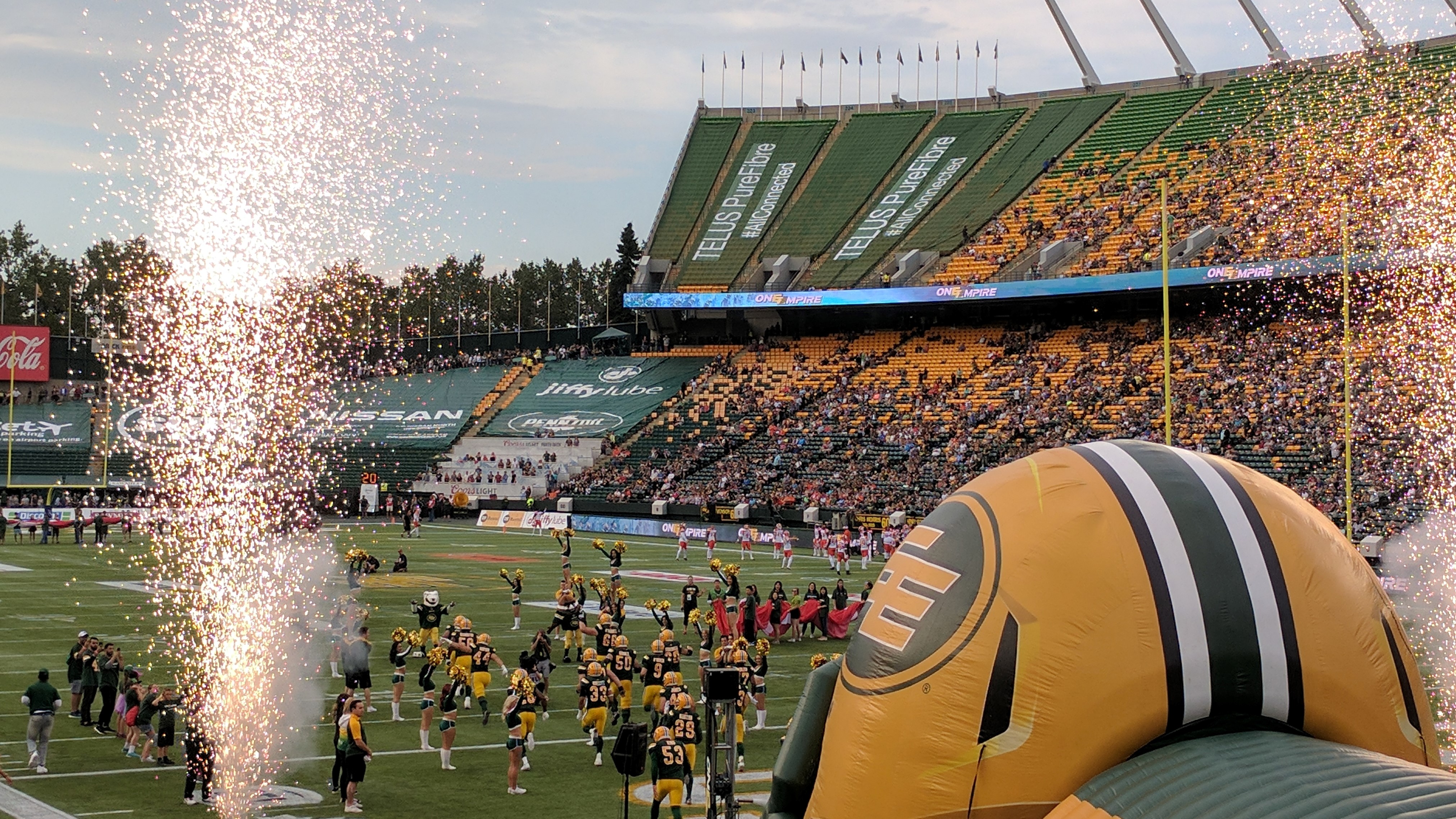Edmonton Eskimos charge onto the field at a Canadian Football League game in July, 2017