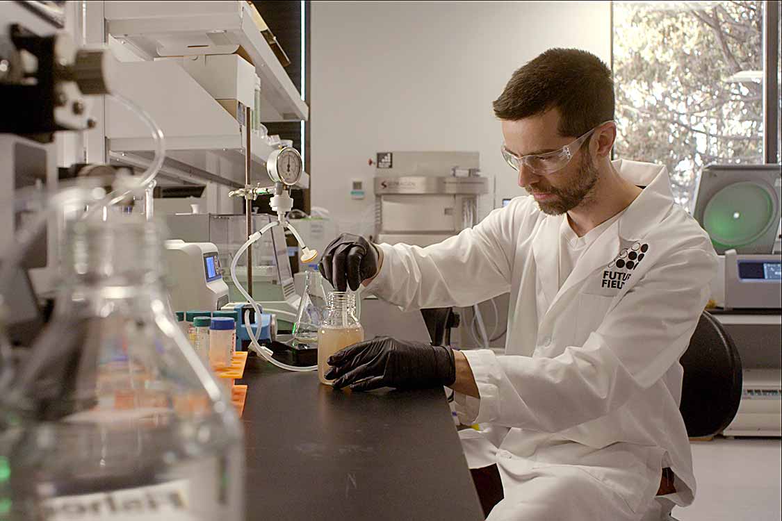 Scientist working with beakers