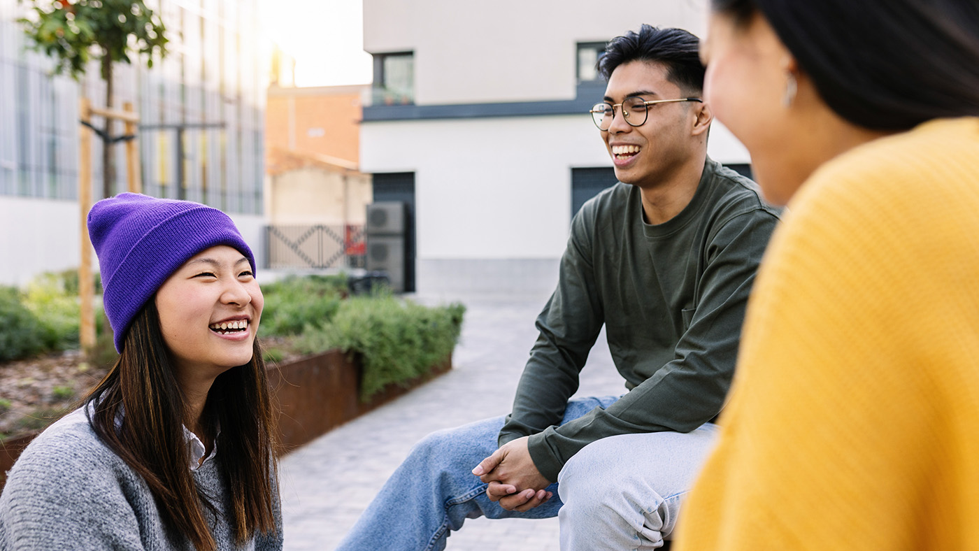 three people smiling