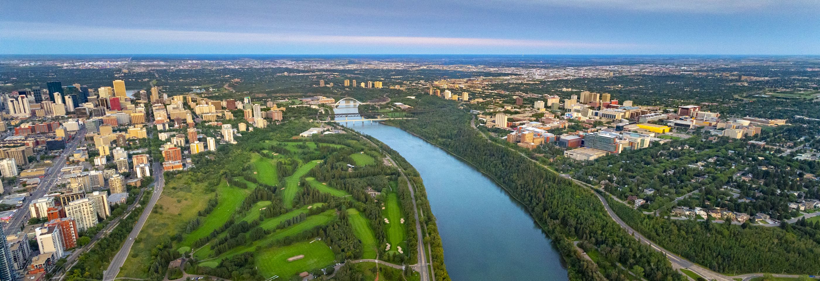 Aerial view over the North Saskatchewan River in Edmonton looking at the U of A North Campus and downtown Edmonton