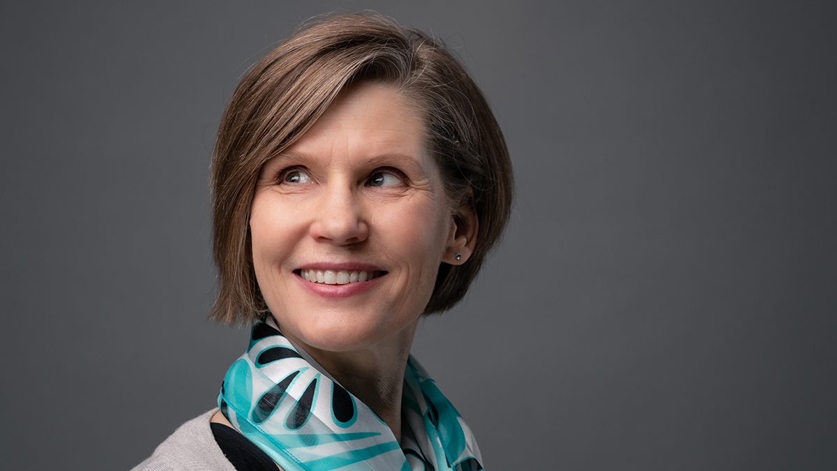 woman smiling with grey background