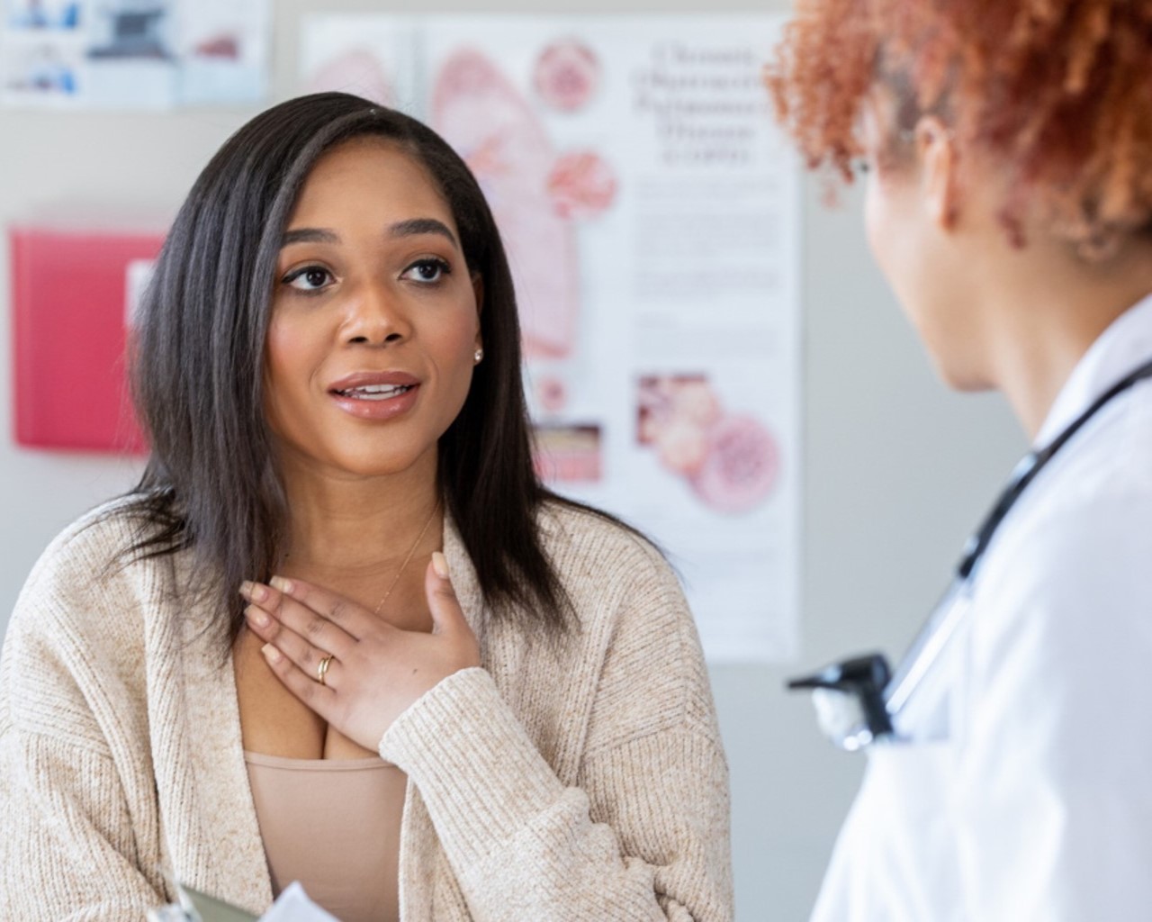 female speaking with medical person