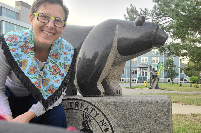 Andrea Menard with Treaty 6 Bear