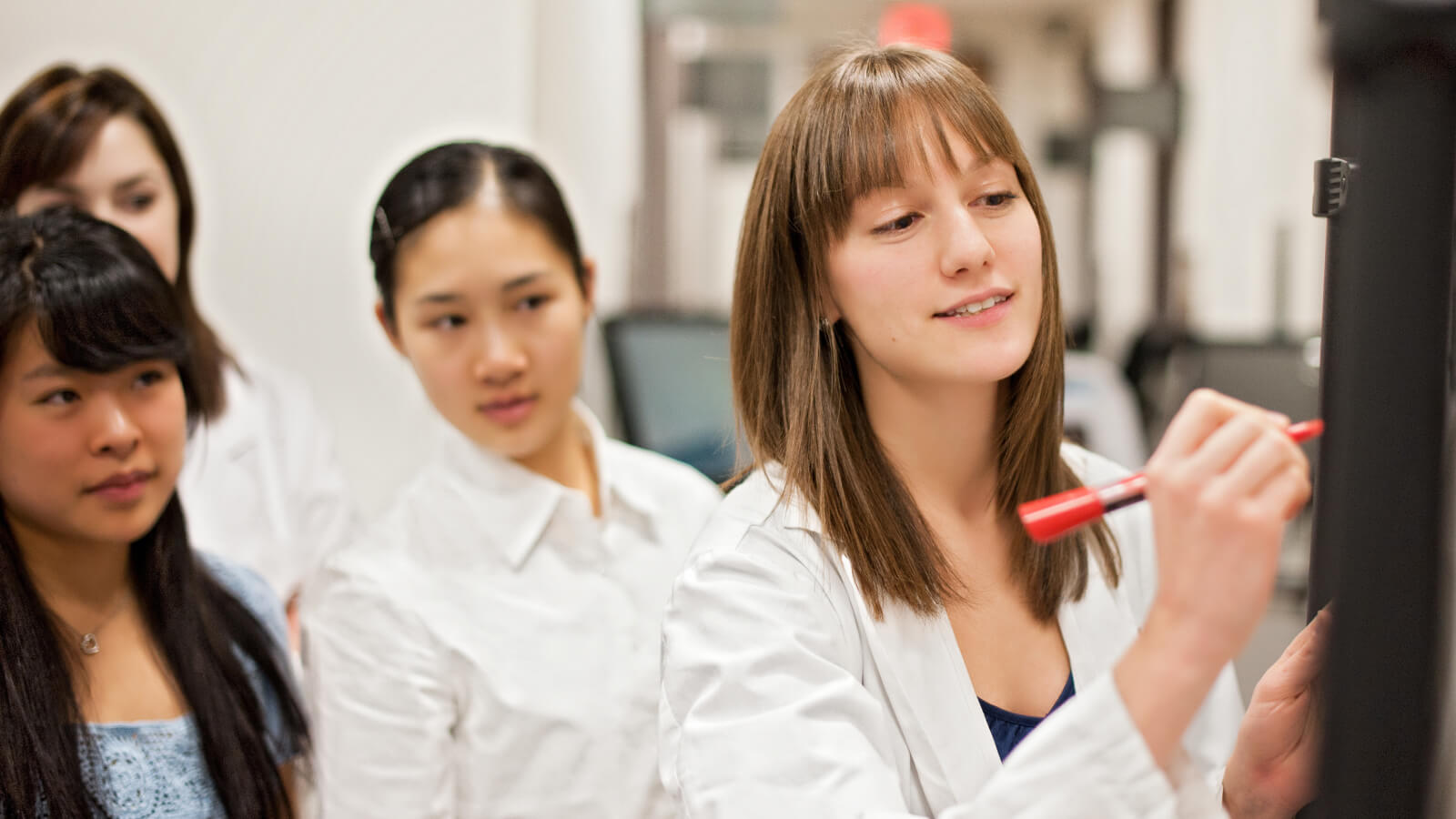 Group of students working on a presentation together