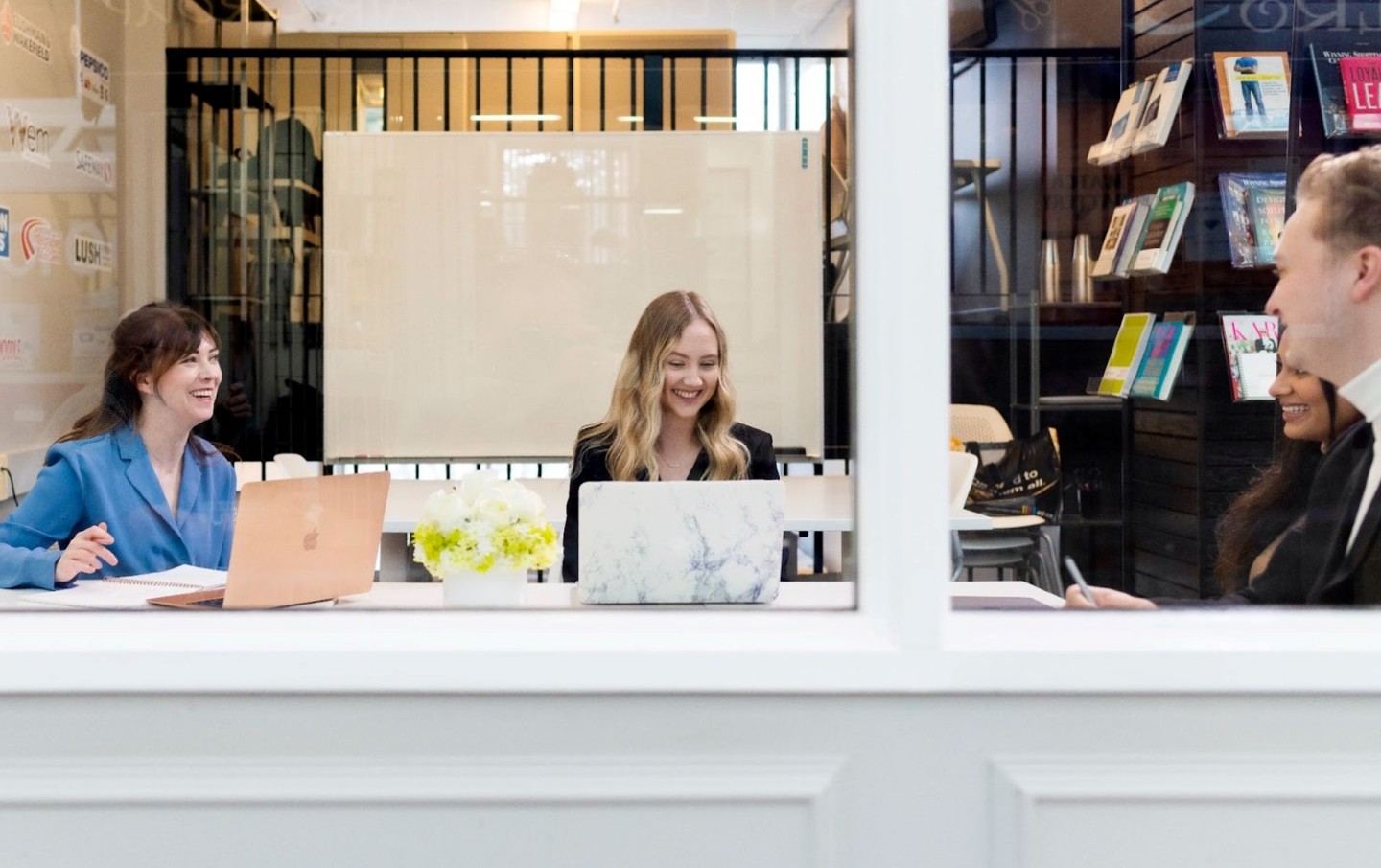 Co-workers sitting at desk together