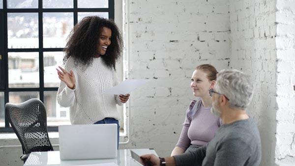 three people in an office