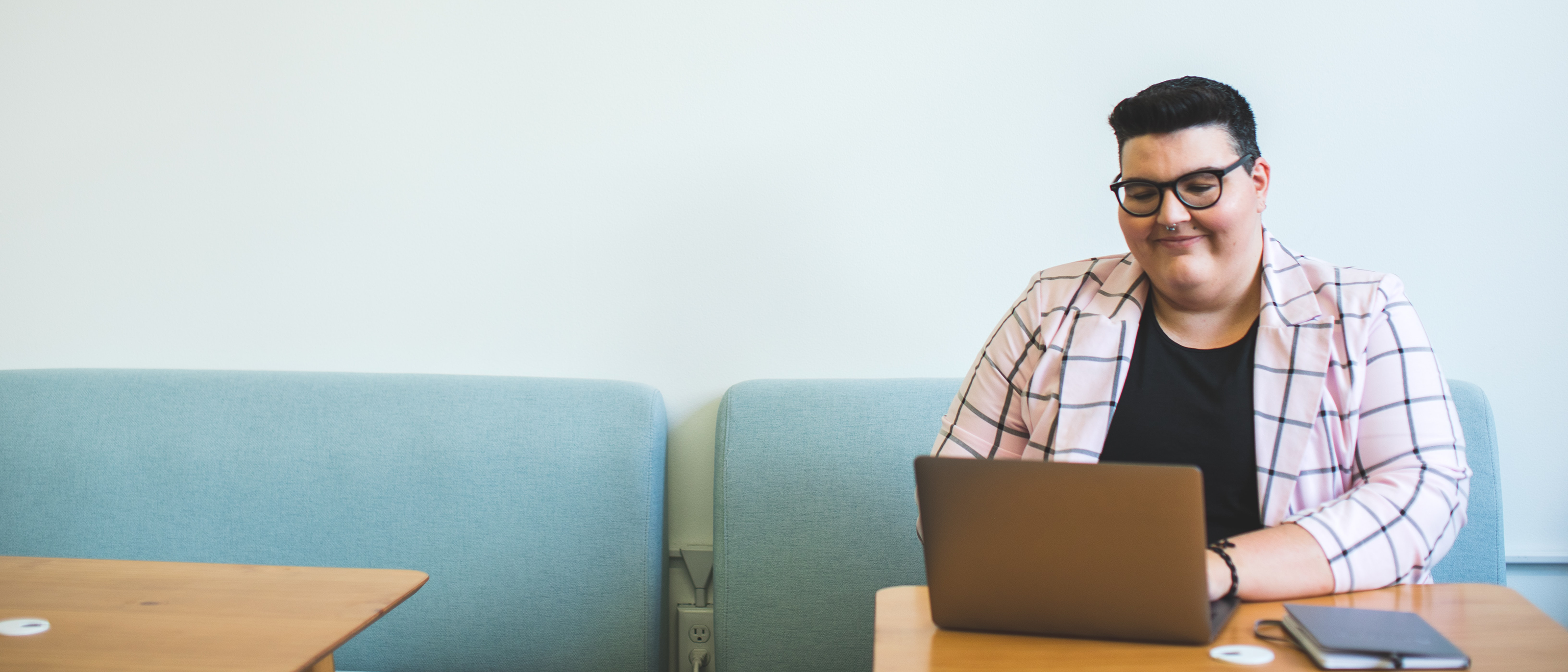 Person at table with laptop