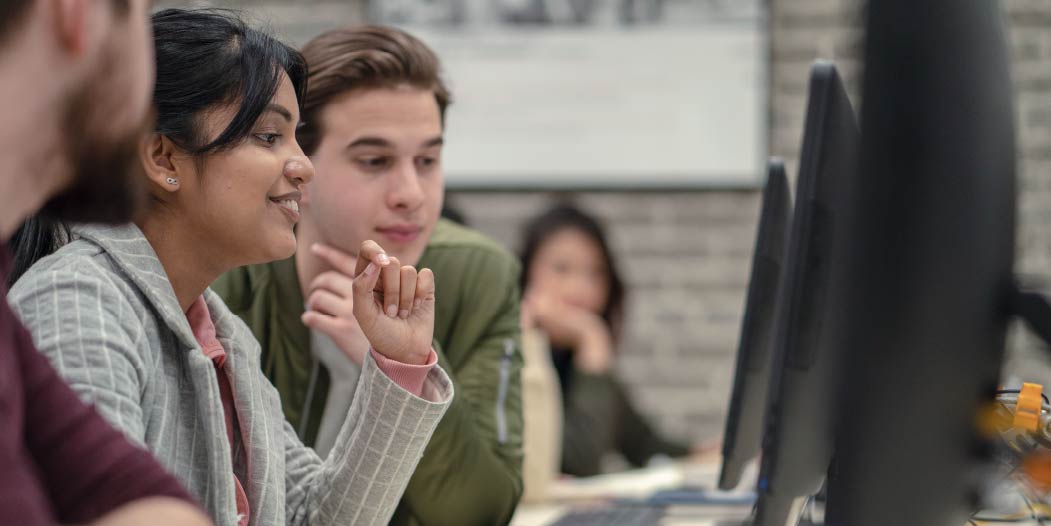 Students work together in a computer lab