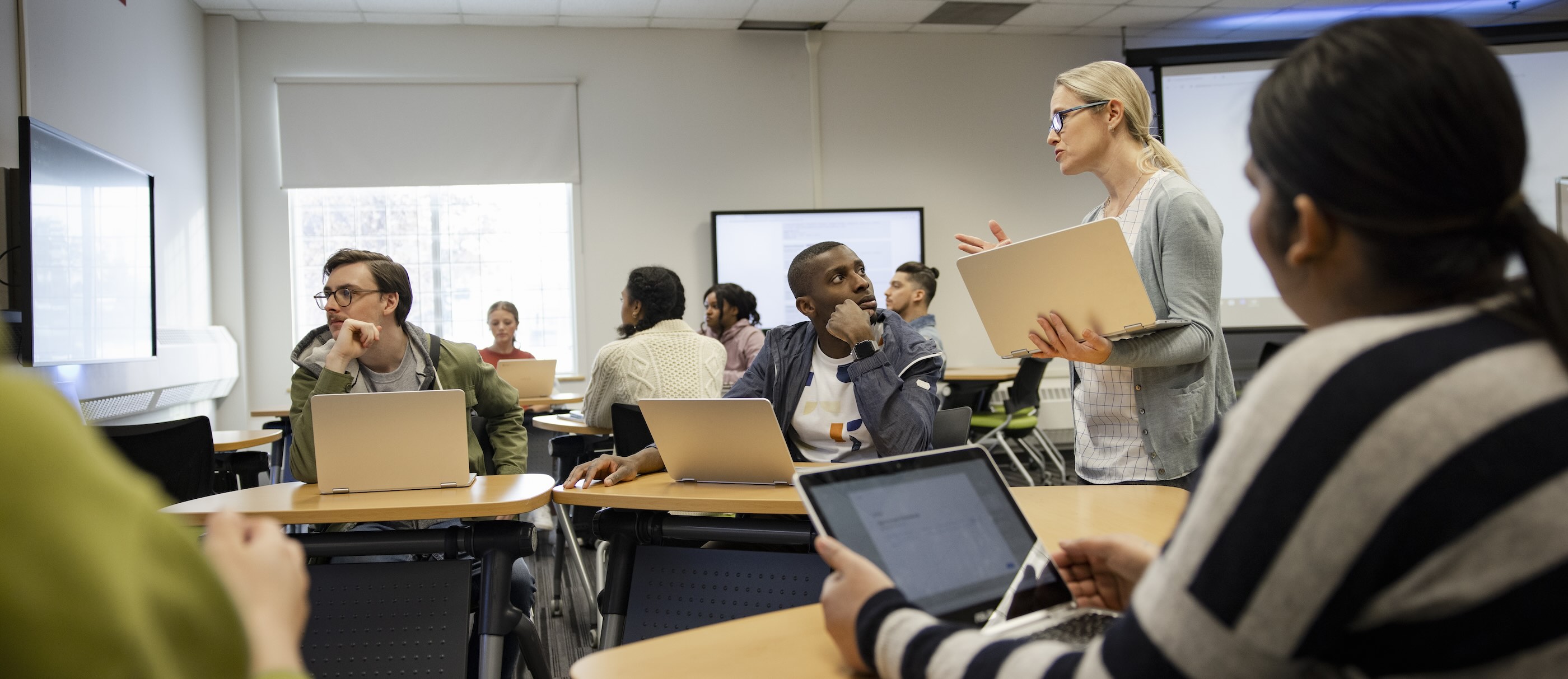 Students participate in a discussion in class.