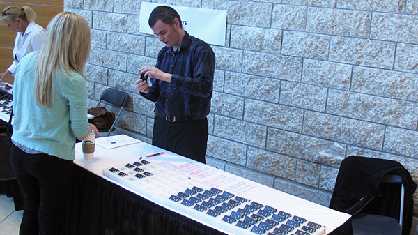 A resident picks up her pager at Resident Orientation Day 2014