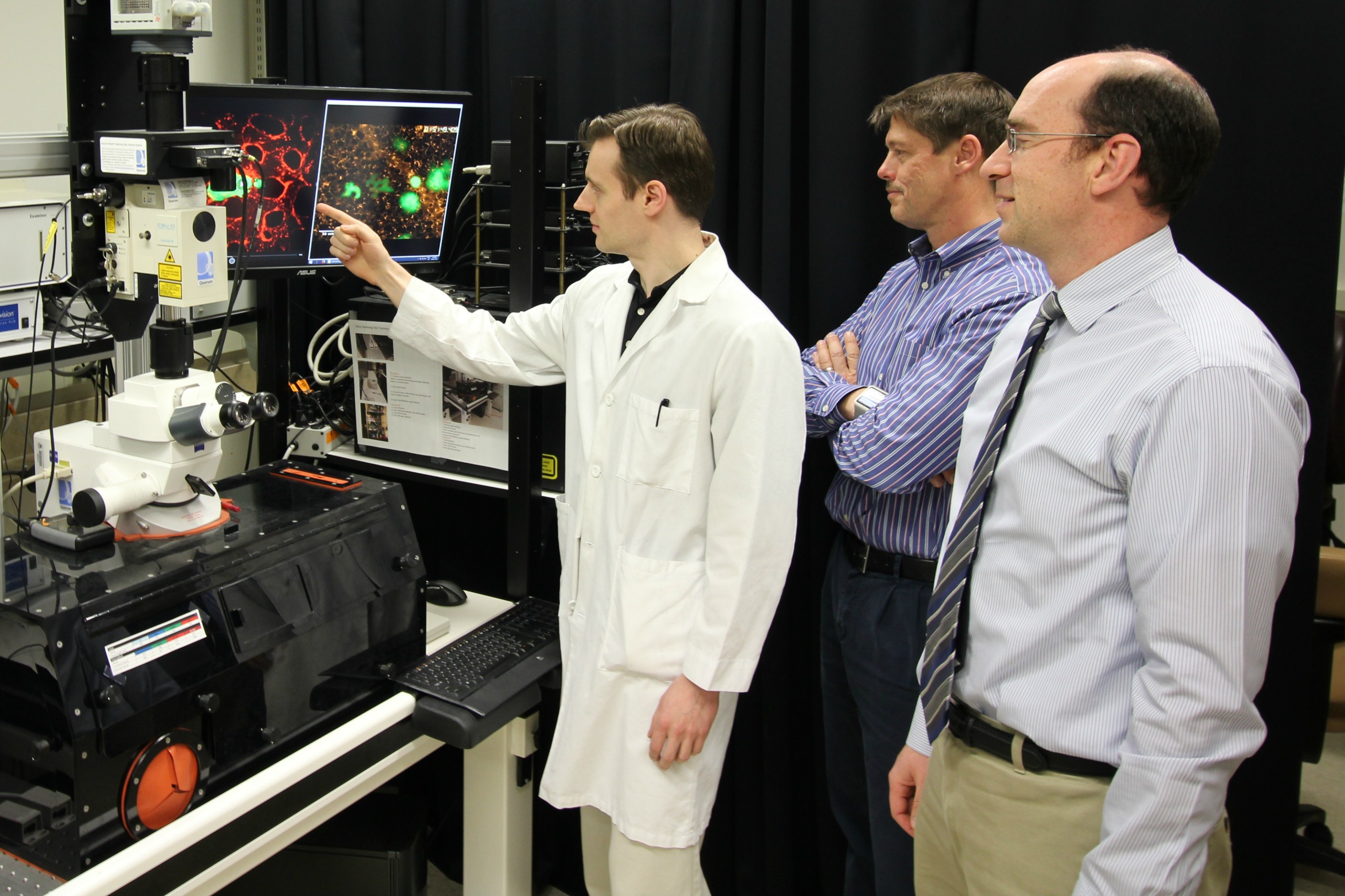 Researchers Robert Paproski, John Lewis and Roger Zemp in a lab space at the University of Alberta