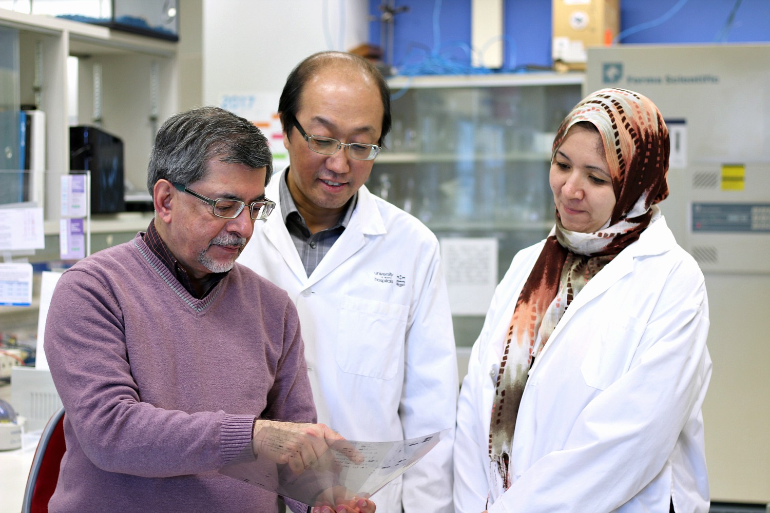 Jack Jhamandas and members of his team in a University of Alberta lab.