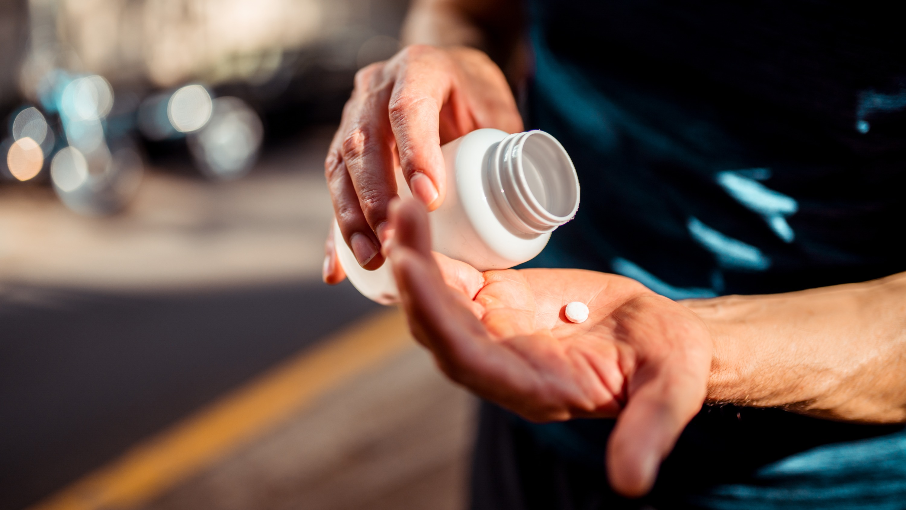 pill being poured into hand