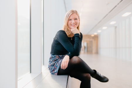 Julia Swatzky sitting by window in U of A 